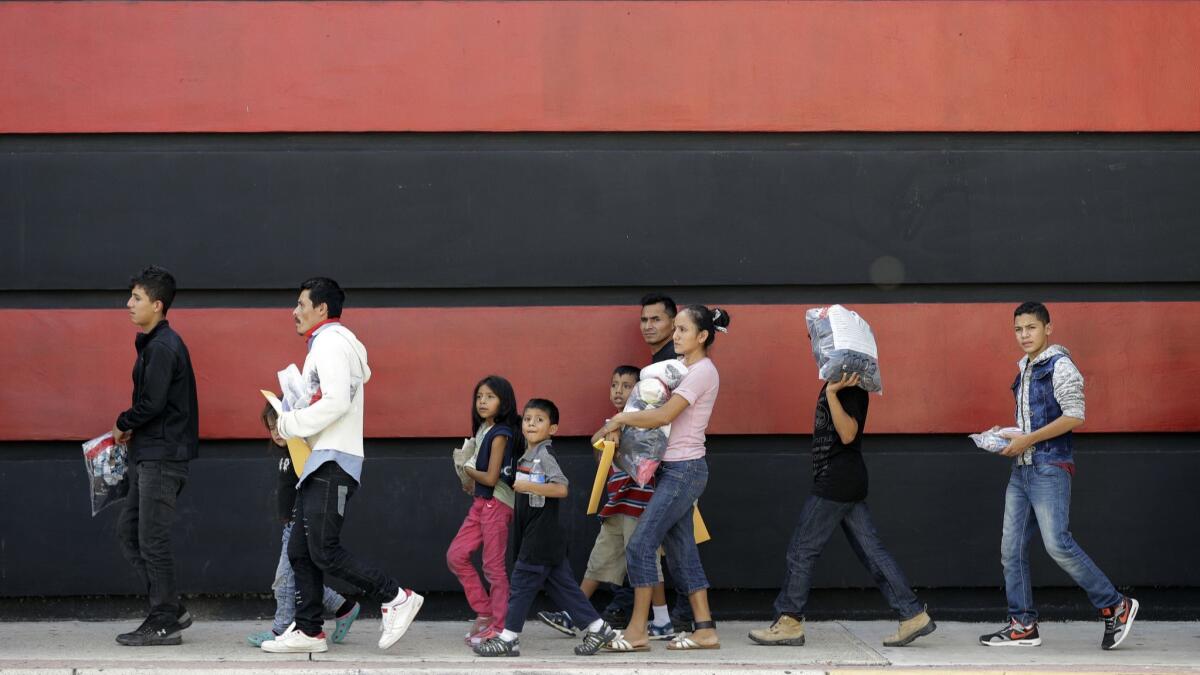 Immigrant families on their way to a respite center after they were processed and released by U.S. Customs and Border Protection on Sunday in McAllen, Texas.