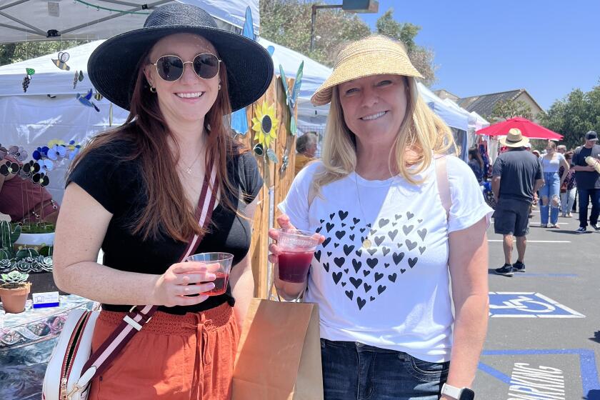 Attendees at Bernardo Winery’s 2023 Spring Arts & Crafts Fair enjoying beverages as they shopped.