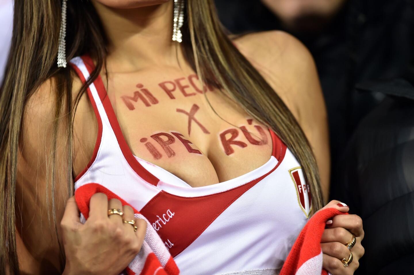 A supporter of Peru poses for pictures as she waits for the start of the 2015 Copa America football championship quarter-final match between Peru and Bolivia, in Temuco, Chile, on June 25, 2015. AFP PHOTO / YURI CORTEZYURI CORTEZ/AFP/Getty Images ** OUTS - ELSENT, FPG - OUTS * NM, PH, VA if sourced by CT, LA or MoD **