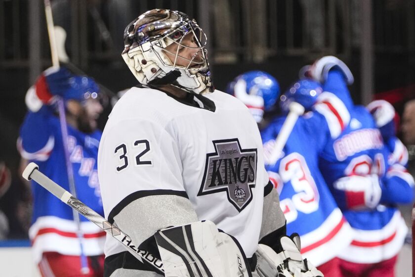 Los Angeles Kings' Jonathan Quick (32) reacts as the New York Rangers celebrate a goal by Vincent Trocheck.