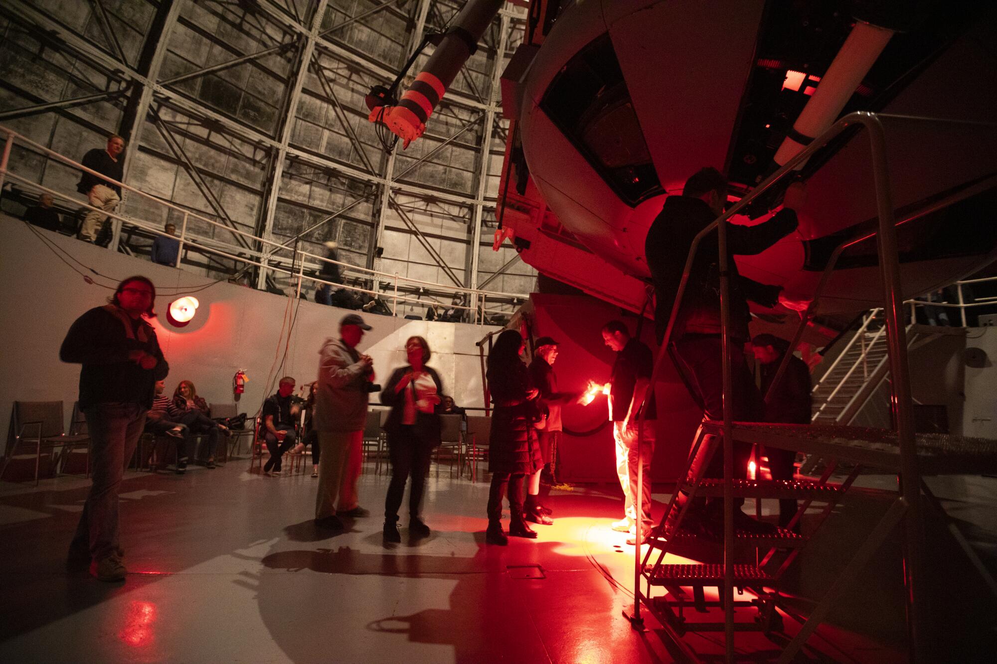 Guests line up to view stars though a telescope at Mt. Wilson Observatory.
