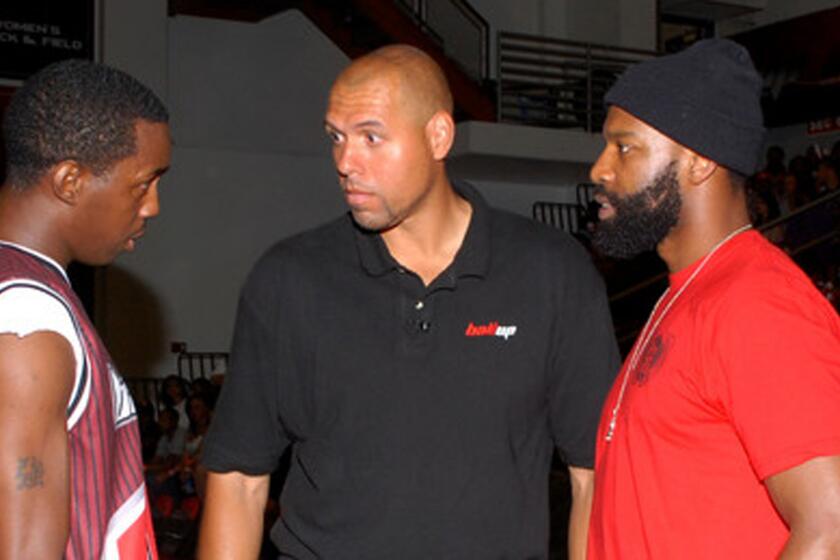Tracy Murray, center, coaches an all-star team along with Baron Davis, right, during the Ball Up Championship Game at Cal State Northridge on June 24, 2011.