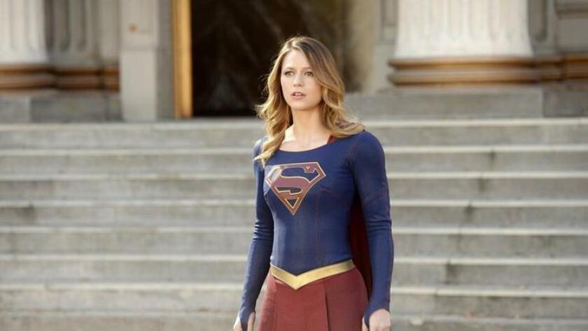 In this image released by CBS, Melissa Benoist appears in a scene from "Supergirl." The CW said Thursday, May 12, 2016, that it's picking up the series from CBS, where it debuted last year. (Darren Michaels/Warner Bros. Entertainment Inc. via AP)