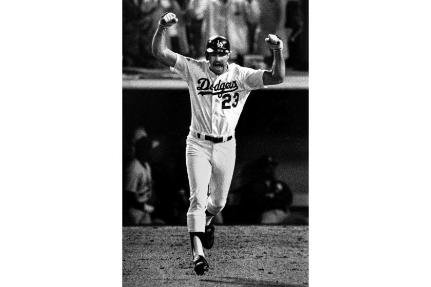 Oct. 15, 1988: Kirk Gibson raises his arms in celebration after hitting a game-winning two-run homer.