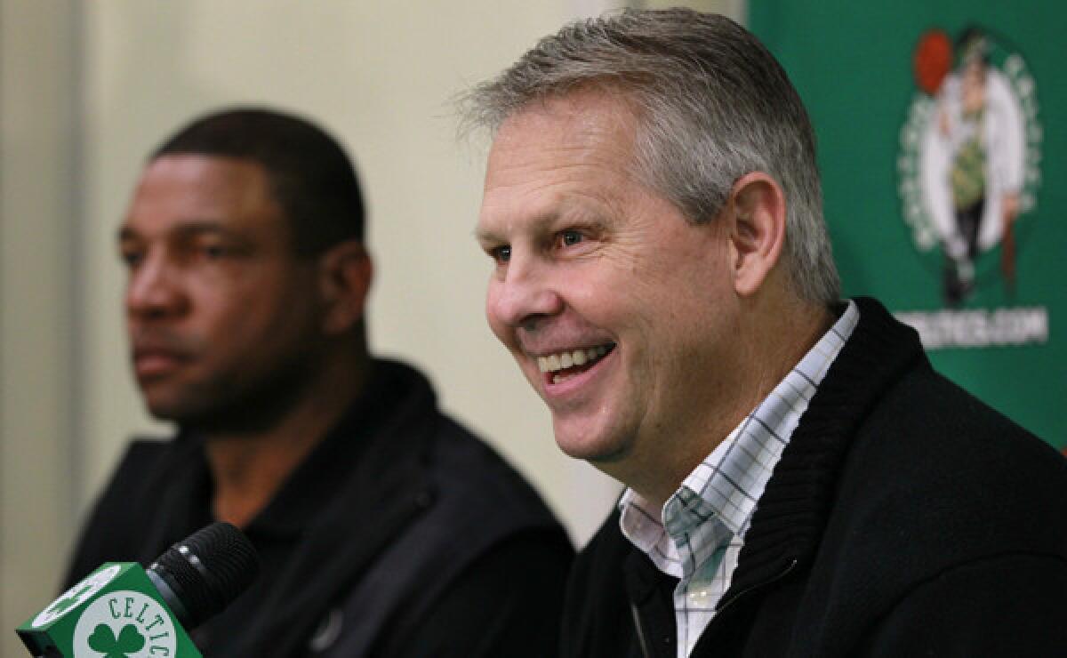 Boston Celtics president of operations Danny Ainge, right, speaks at a news conference in 2011 while sitting next to Doc Rivers. Ainge says Rivers decided to become the Clippers' coach because he felt it was time for a change.