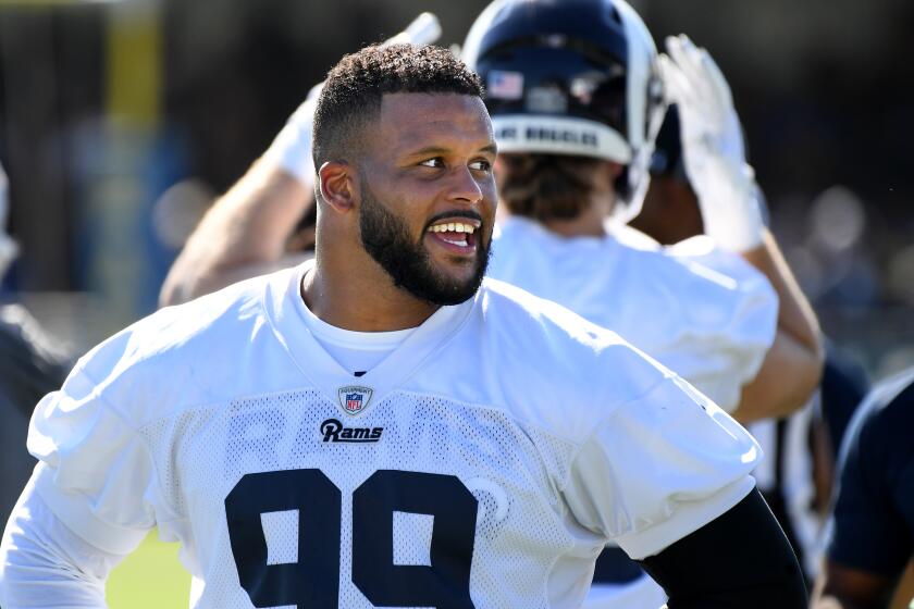 IRVINE, CALIFORNIA JULY 27, 2019-Rams Aaron Donald takes a break during the opening of training camp at U.C. Irvine Saturday. (Wally Skalij/Los Angeles Times)