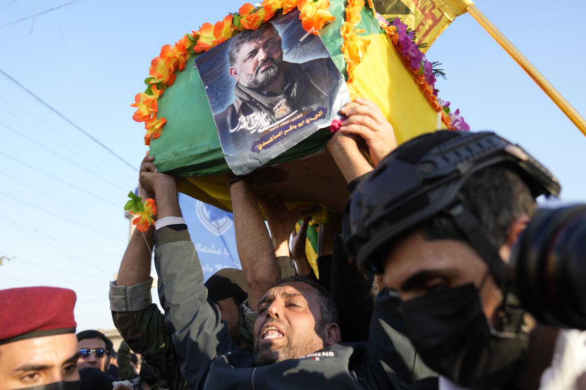 People carry a coffin in Iraq.