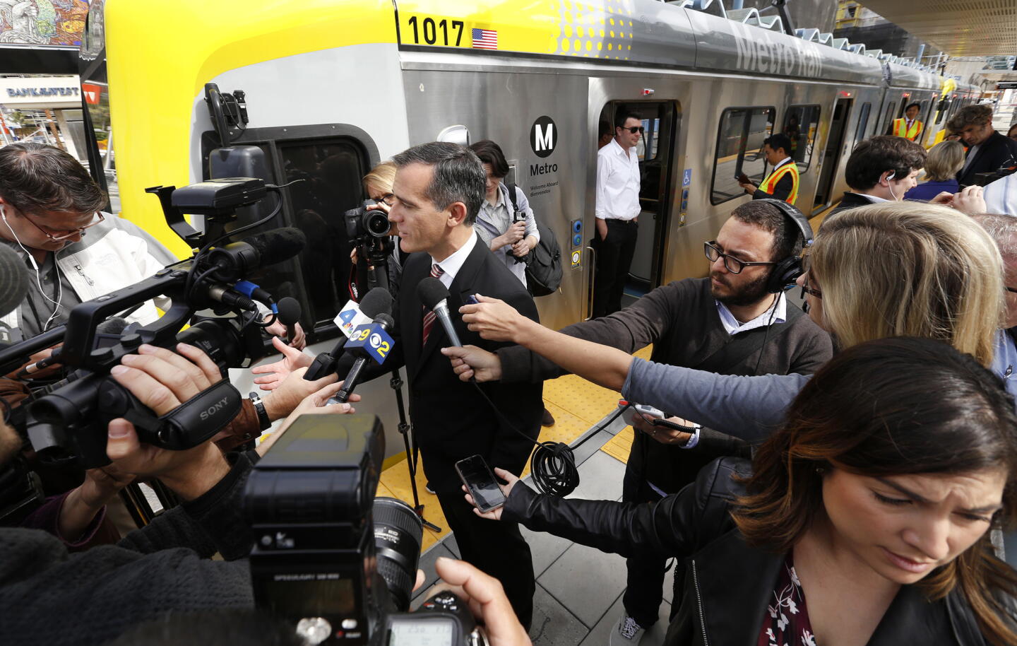 Mayor Eric Garcetti talks to reporters who traveled with Metro board members during a test run of the Expo Line between the Culver City Station and downtown Santa Monica on May 9.