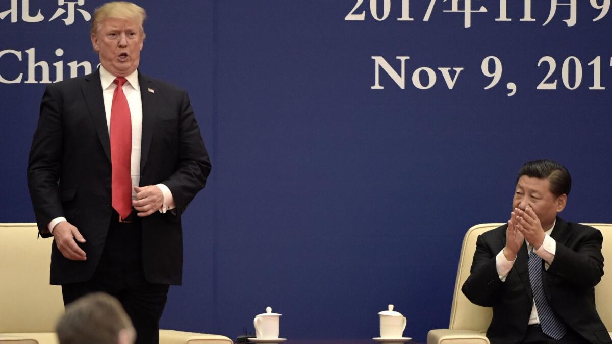 President Trump speaks at a business meeting Nov. 9 with Chinese President Xi Jinping at the Great Hall of the People in Beijing.