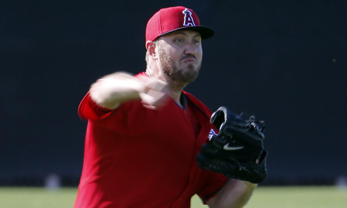 Angels reliever Kevin Jepsen throws during a spring training practice session on Feb. 15. Jepsen hopes his new delivery will allow him to stay healthy and productive in 2014.