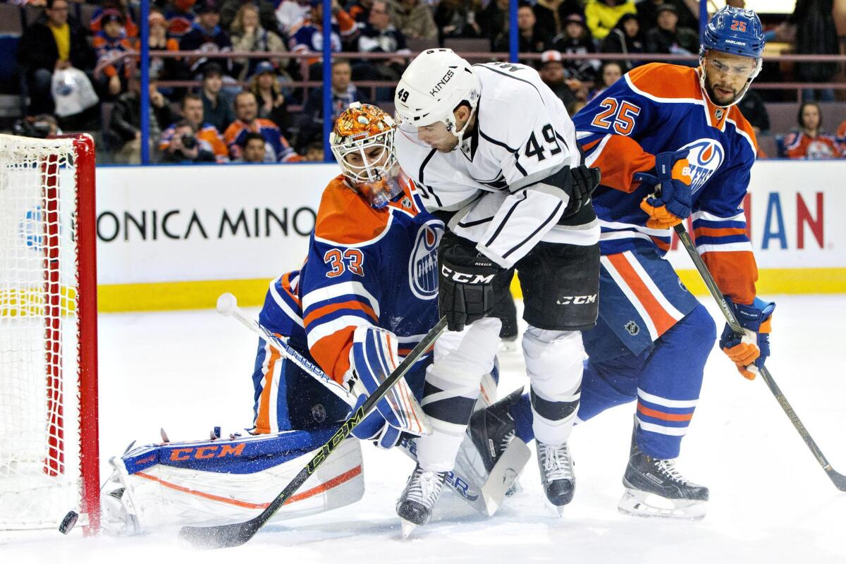 Kings forward Michael Mersch (49) scored his first career goal against the Oilers Tuesday, but is stopped by goalie Cam Talbot (33) on this play.