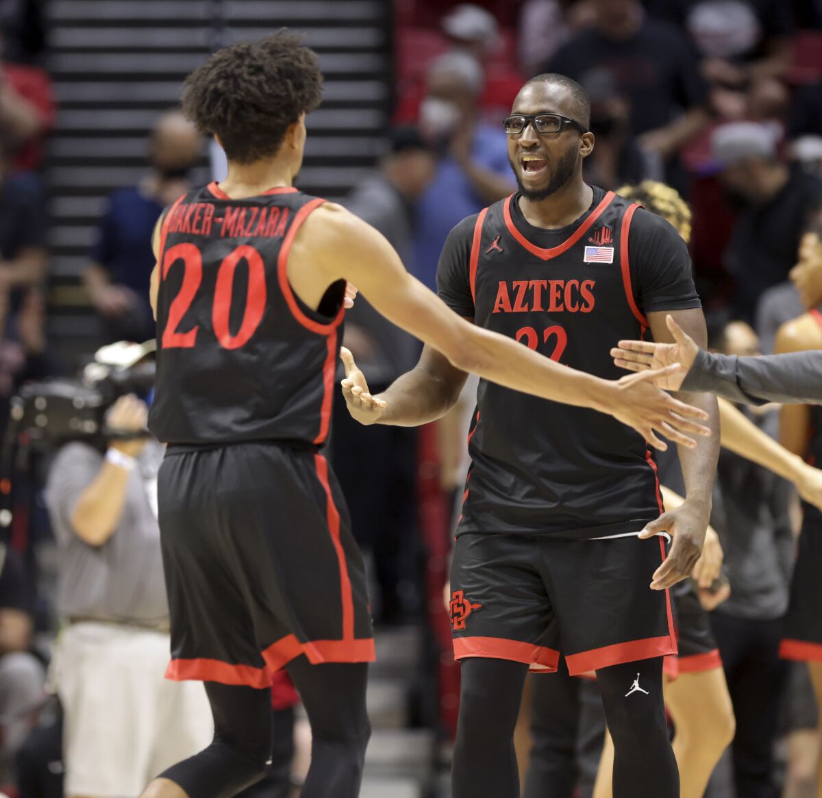 Tahirou Diabate (right) and the rest of the Aztecs, including Chad Baker-Mazara, had plenty of reasons to smile Saturday.