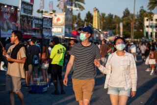 People walk through Santa Anita Park. 