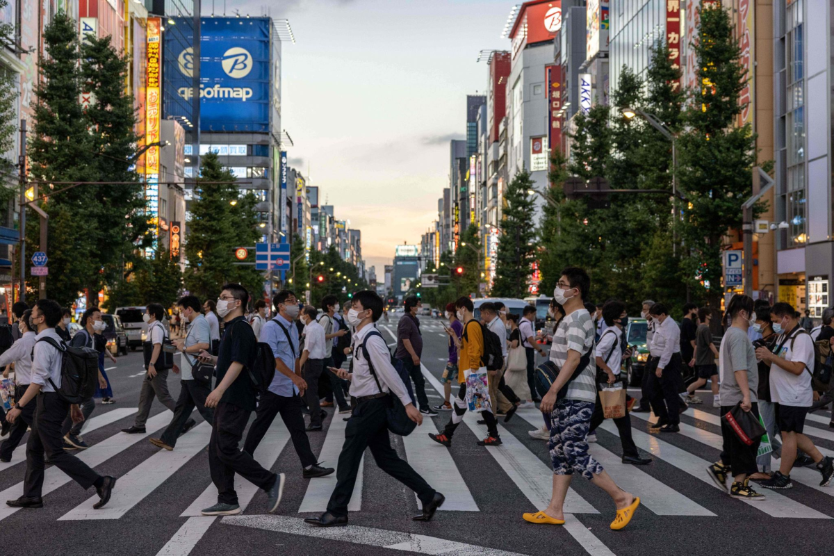 People walk on the street in the Akihabara district in Tokyo on Wednesday.