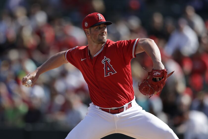 Los Angeles Angels relief pitcher Mike Mayers works against a Colorado Rockies batter during the third inning of a spring training baseball game Sunday, Feb. 23, 2020, in Tempe, Ariz. (AP Photo/Gregory Bull)