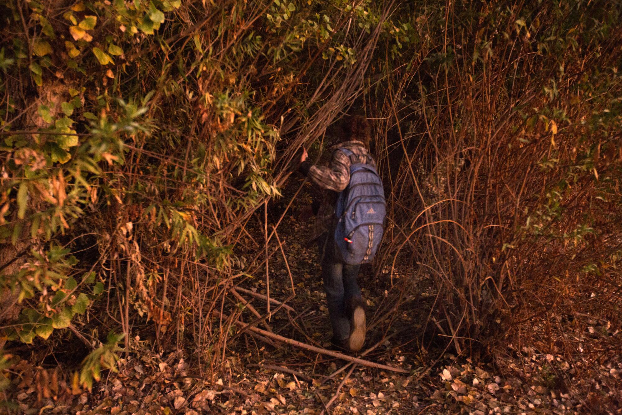 Elizabeth Bolton returns to the homeless encampment in Lake Balboa in November 2019.