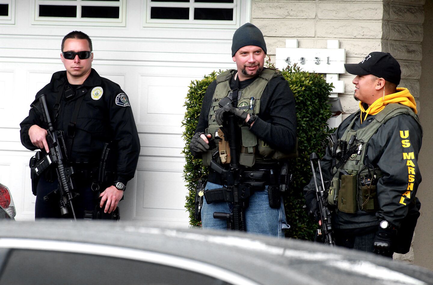 Irvine police and U.S. marshals stand outside home of Christopher Dorner's mother in La Palma.