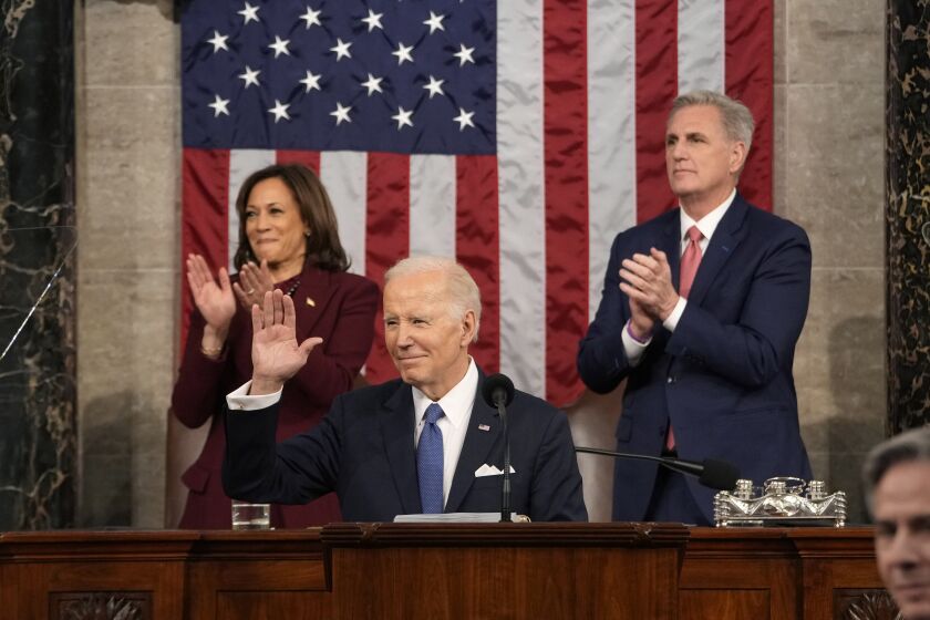 President Joe Biden waves as he delivers the State of the Union address to a joint session of Congress at the U.S. Capitol, Tuesday, Feb. 7, 2023, in Washington, as Vice President Kamala Harris and House Speaker Kevin McCarthy of Calif., applaud. (Jacquelyn Martin, Pool)
