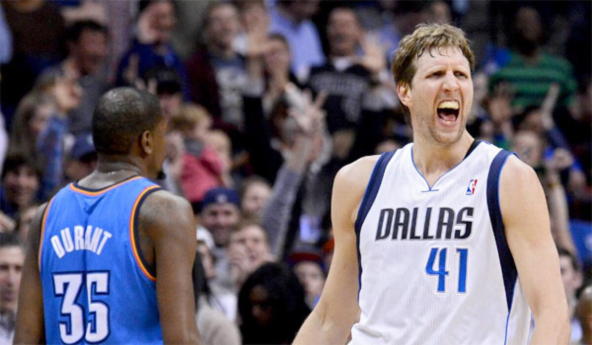 Dirk Nowitzki celebrates after hitting a three during the Mavericks' game against the Thunder. Nowitzki had 32 points for Dallas in a 128-119 overtime victory over Oklahoma City.