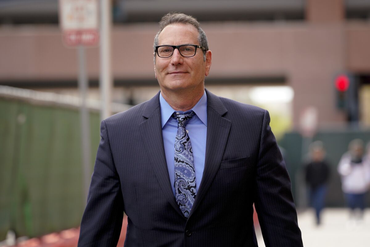 Former sheriff's Capt. Marco Garmo leaves federal court on March 12, 2021, after being sentenced to two years in prison.