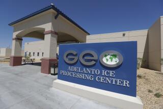 FILE - In this Aug. 28, 2019, file photo, the Adelanto U.S. Immigration and Enforcement Processing Center operated by GEO Group, Inc. (GEO), a Florida-based company specializing in privatized corrections, is viewed in Adelanto, Calif. The Trump administration has awarded four contracts worth billions of dollars to operate private immigration detention centers in California, less than two weeks before a new state law forbidding them takes effect. (AP Photo/Chris Carlson, File)