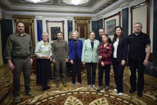 In this photo provided by the Ukrainian Presidential Press Office, Ukrainian President Volodymyr Zelenskyy, third from left, pose for a photo with Eco-activist Greta Thunberg, third right, Vice-President of the European Parliament Heidi Hautala, center, ex-Deputy Prime Minister and ex-Minister of Foreign Affairs of Sweden Margot Wallstrom, second from left, President of Ireland in 1990-1997 Mary Robinson, fourth from left, and Ukrainian officials during their meting in Kyiv, Ukraine, Thursday, June 29, 2023. (Ukrainian Presidential Press Office via AP)