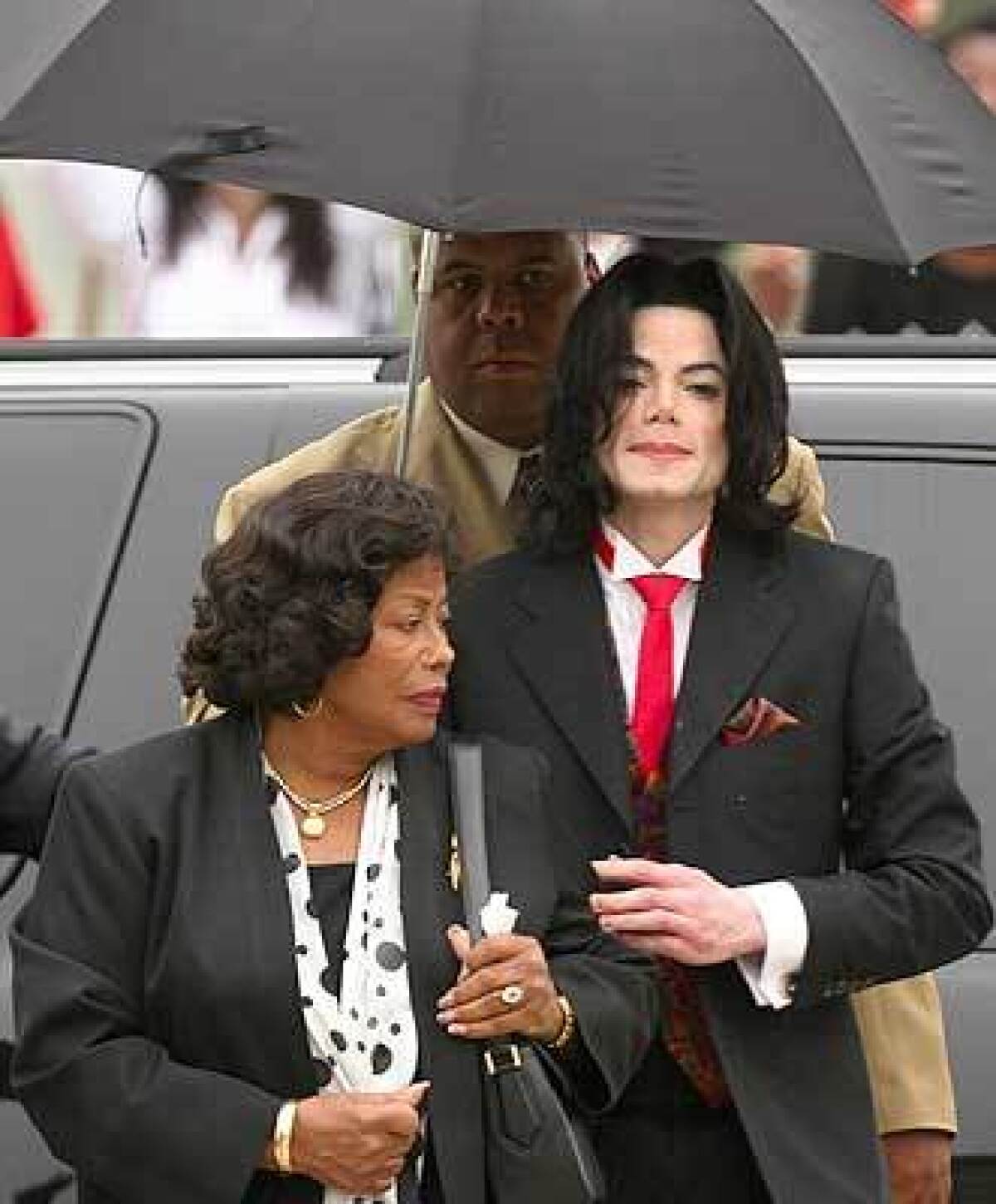 Michael Jackson arrives at the Santa Barbara County courthouse with his mother, Katherine, in May 2005, during his trial on child-molestation charges.