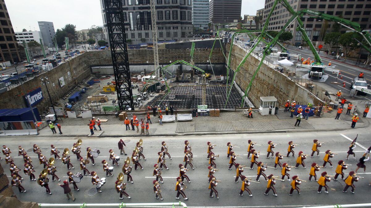 USC's marching band on Saturday kicked off what was billed as the world's largest continuous pouring of concrete at the New Wilshire Grand project site in downtown Los Angeles.