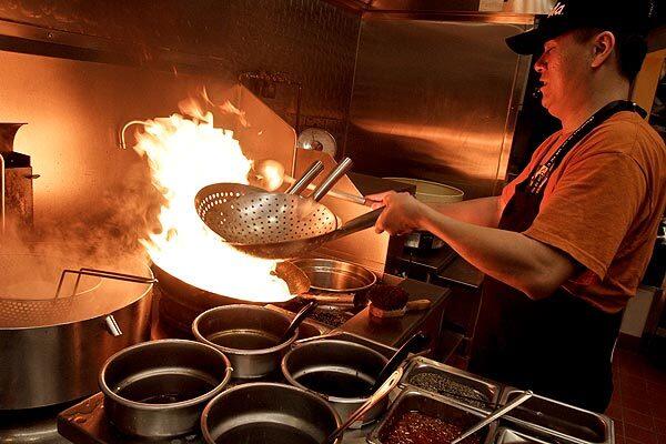 Aaron Wu gets hands-on experience in the kitchen at the Panda Restaurant Group training center in Rosemead. Bars and restaurants in the U.S. added 34,000 jobs in September, while the entire economy added 64,000 jobs.