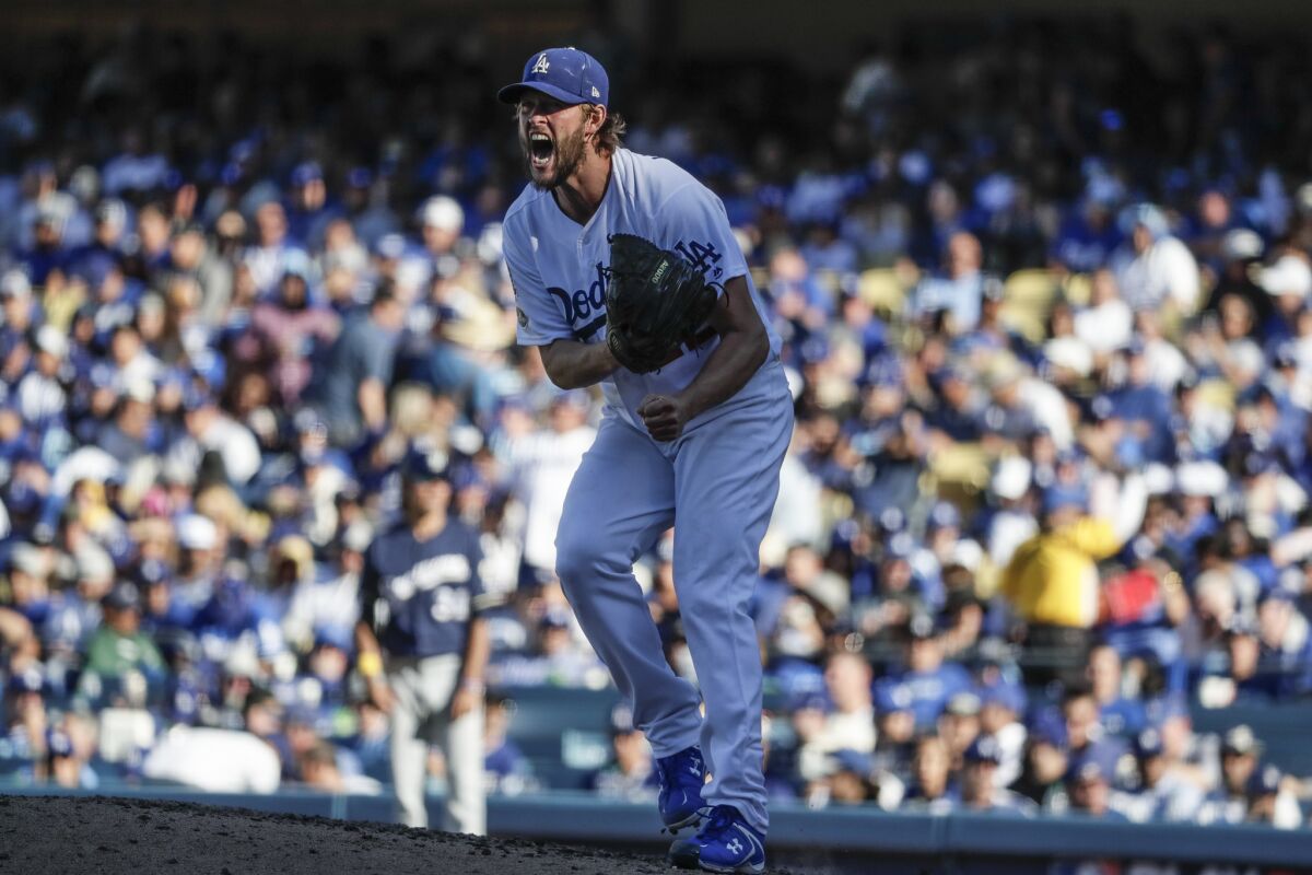 Dodgers starter Clayton Kershaw shows an emotional outburst while pitching against the Brewers in the sixth inning.