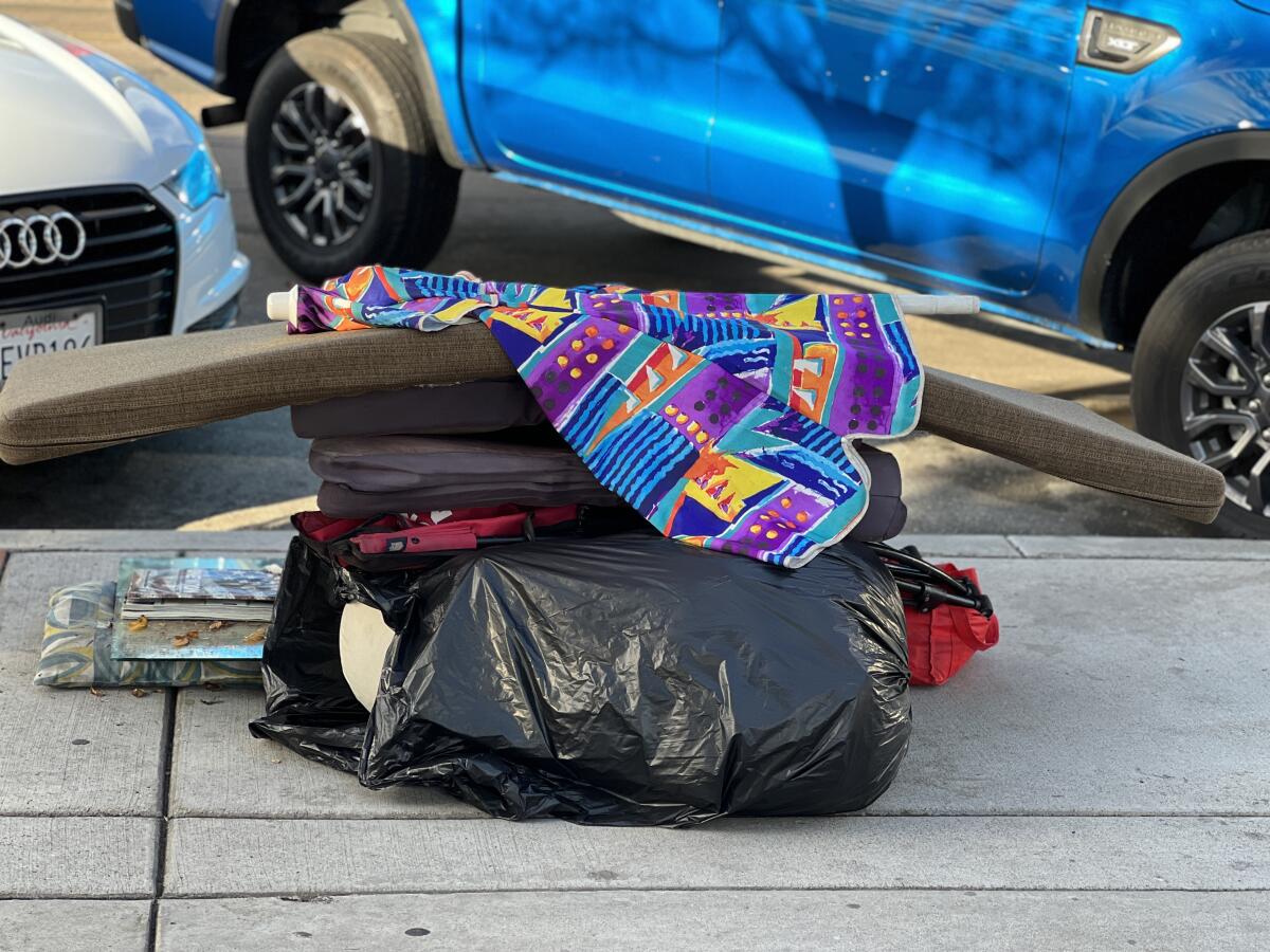 A homeless person's belongings lie on the sidewalk on Fay Avenue in La Jolla.