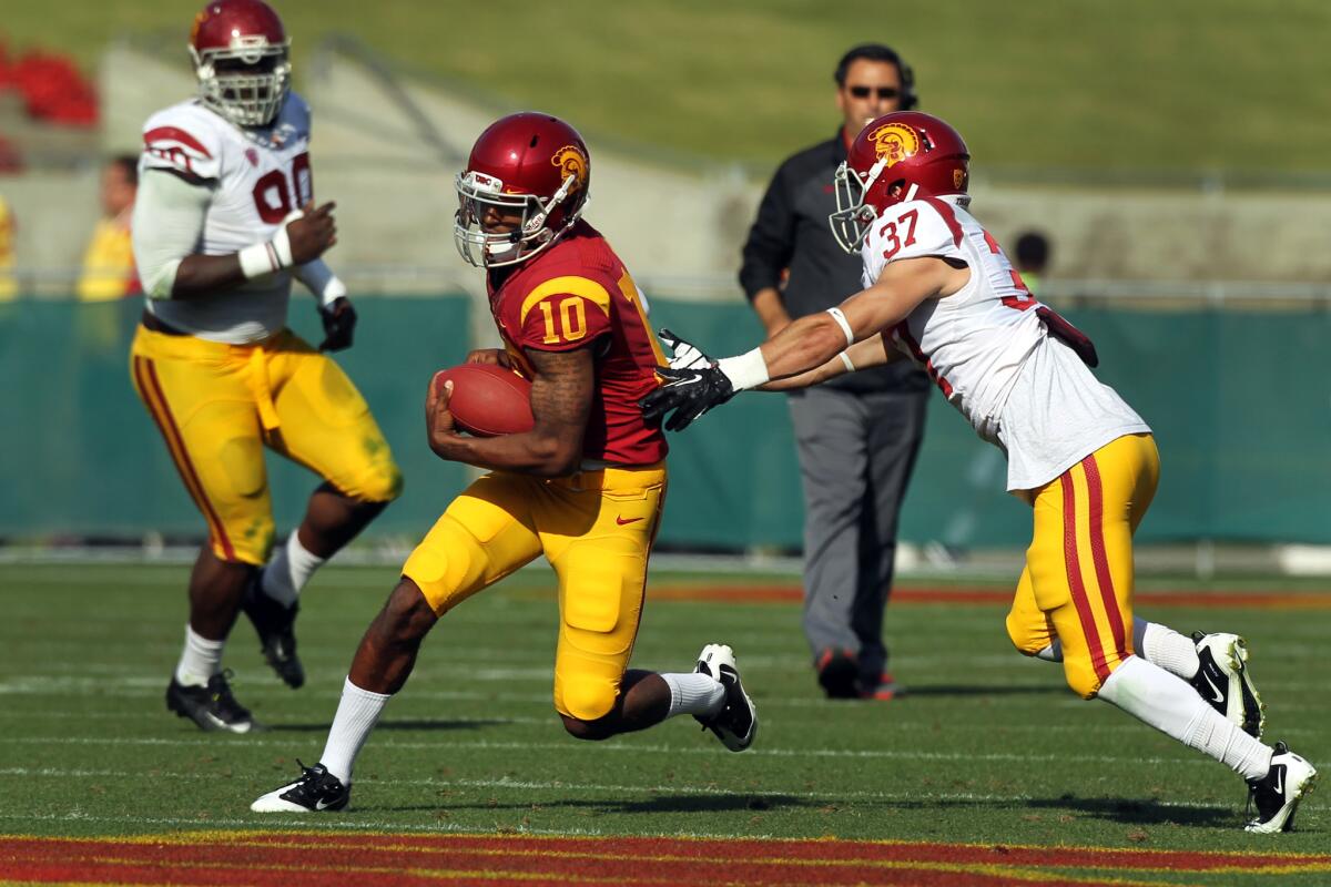 Jalen Greene plays quarterback for USC during a spring 2014 game.
