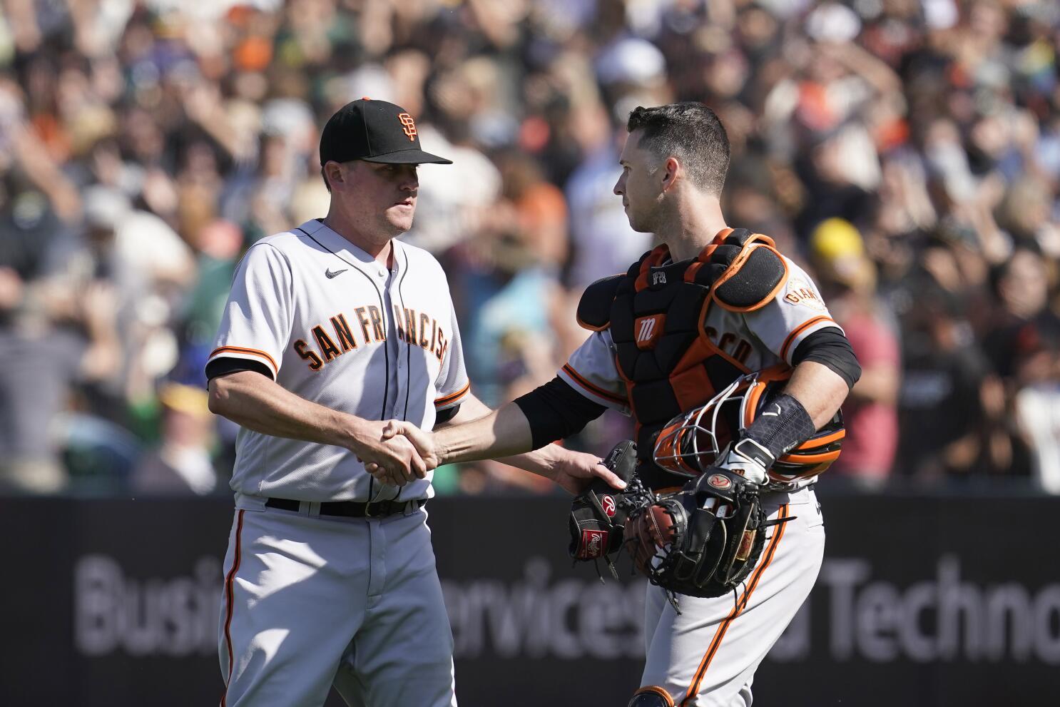 San Francisco Giants' Brandon Belt, left, celebrates with Evan