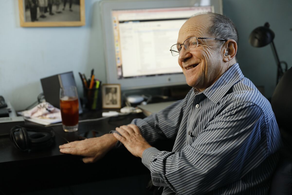 Gary Grossman in front of the computer in his home office.