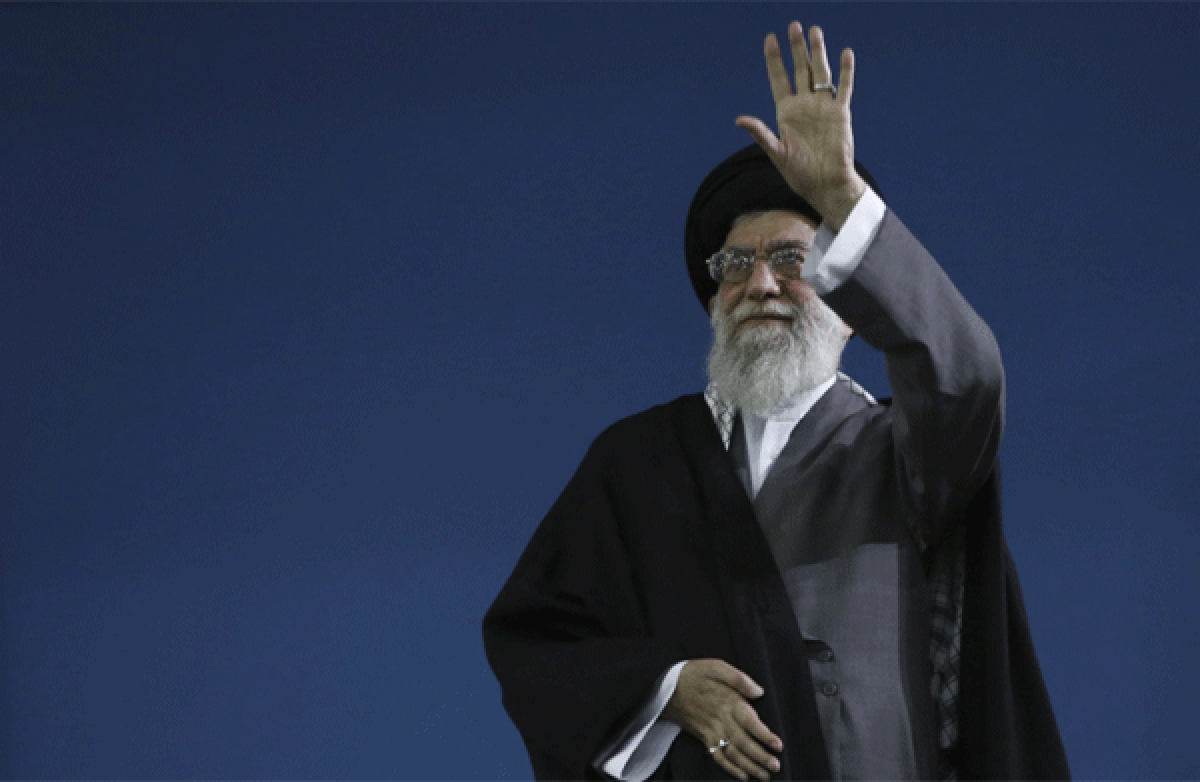 Iran's supreme leader Ayatollah Ali Khamenei waves to the crowd at the conclusion of his speech in Tehran. He said that his country is not seeking nuclear weapons, but that no world power could stop its access to an atomic bomb if it intended to build one.