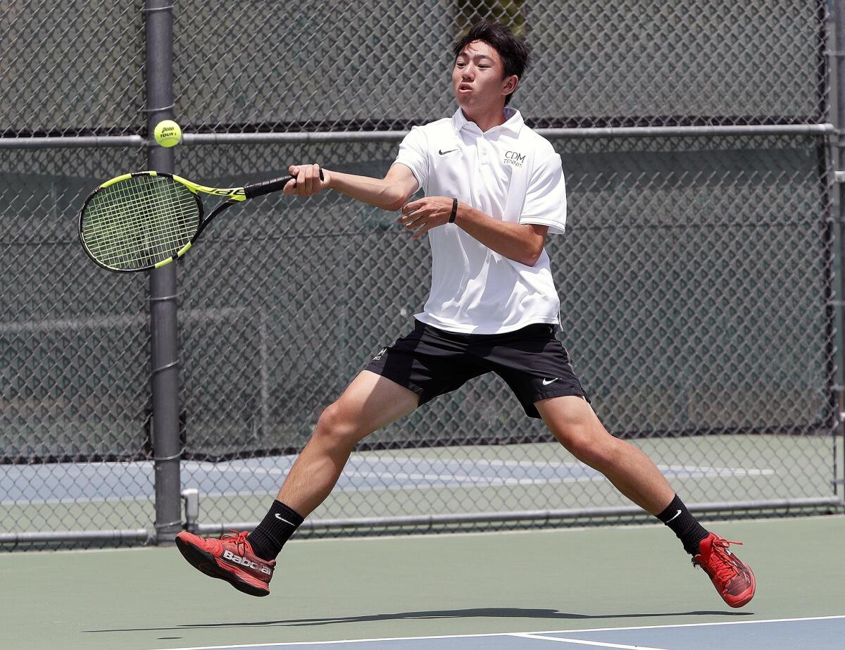 Corona del Mar's Kyle Pham strides to a forehand return in a singles match during the CIF Southern Section Individuals tournament at Andulka Park Tennis Center in Riverside on Friday.