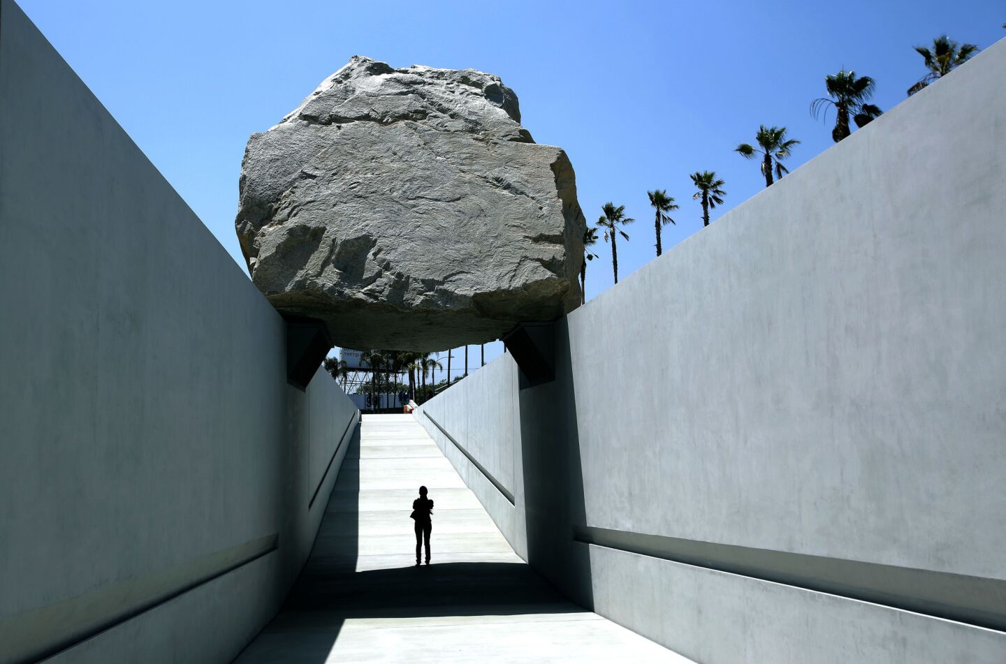 Michael Heizer's "Levitated Mass," the commissioned sculpture at the Los Angeles County Museum of Art, gives visitors the chance to walk underneath a 340-ton granite boulder. Review: LACMA's new hunk 'Levitated Mass' has some substance | Critic's Notebook: Art on an architectural scale at LACMA