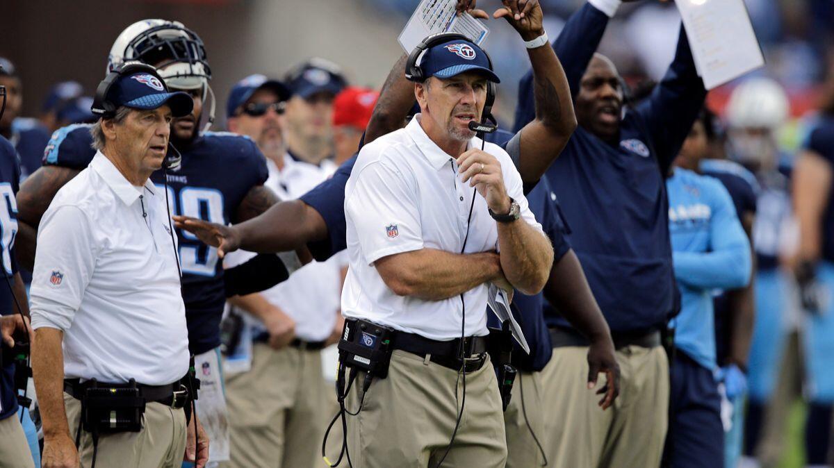 Tennessee Titans head coach Mike Mularkey, center, and defensive coordinator Dick LeBeau, left, during the Nov. 5 game against the Baltimore Ravens. LeBeau used to coach for the Steelers.