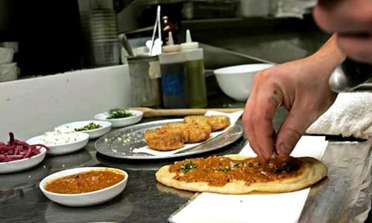 ALL IN FLATBREAD, TOO: Don't be shy -- slather on the ancho-pomegranate sauce.