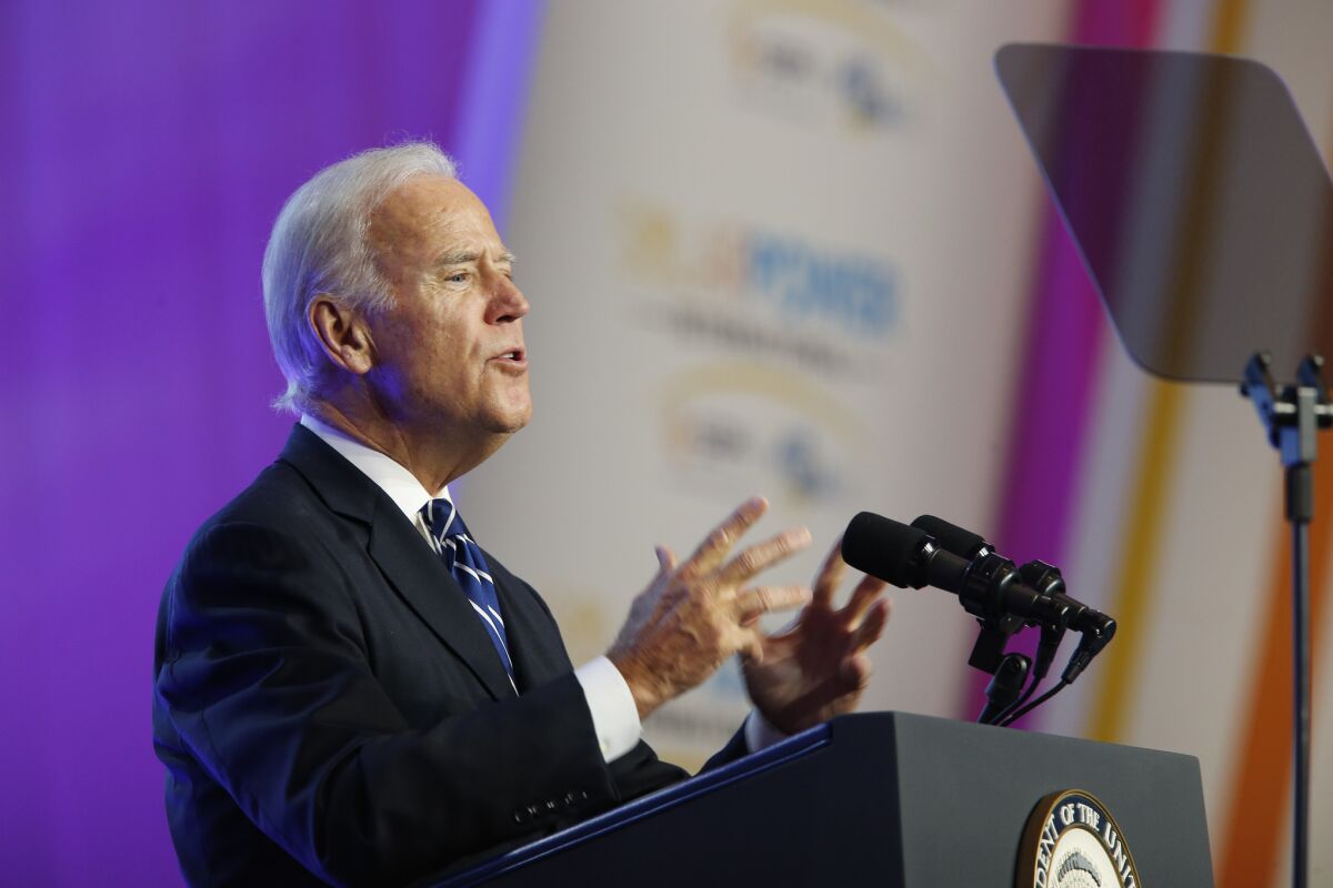 Joe Biden speaks at a lectern