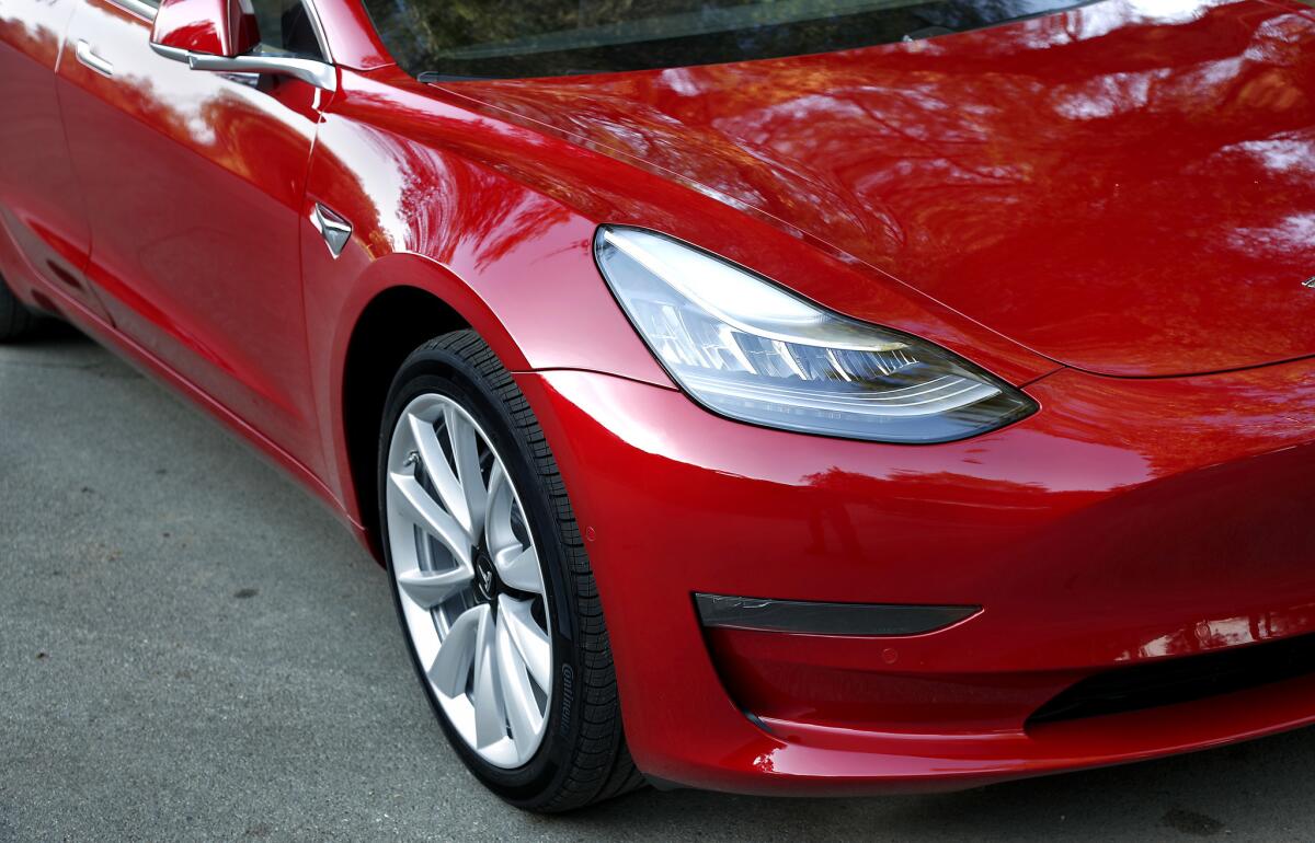 Tesla jumped to No. 11, the highest for any U.S. auto brand, in Consumer Reports' annual auto ranking. Its Model 3 sedan, above, was a top pick for the first time.