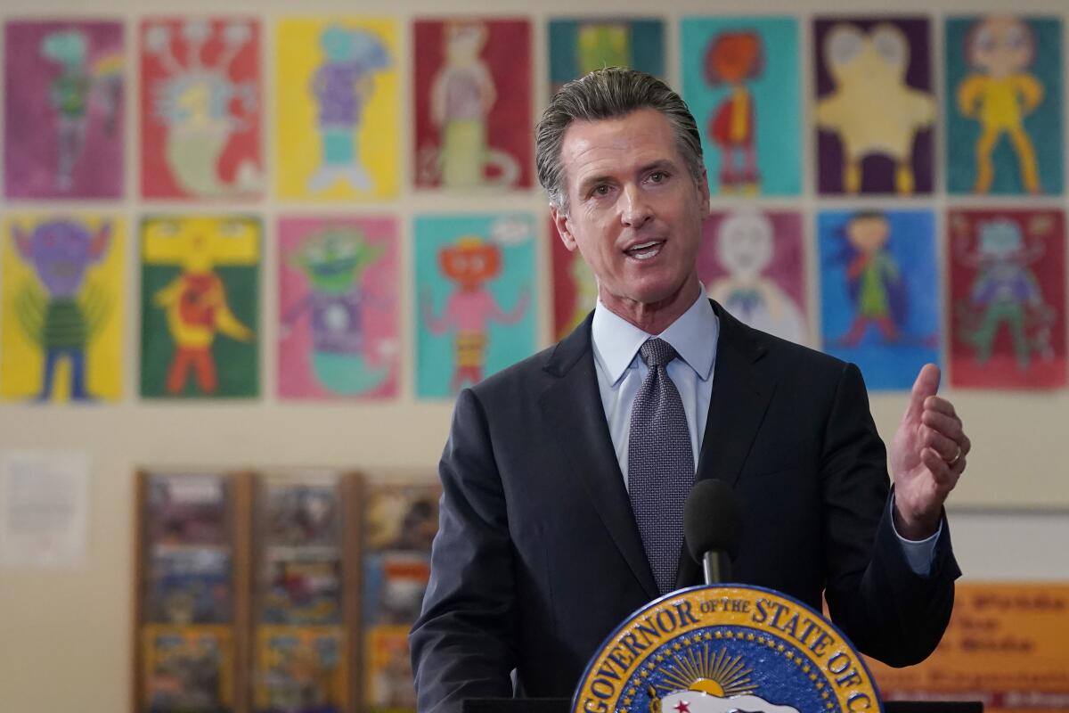 Gov. Gavin Newsom speaks at a podium