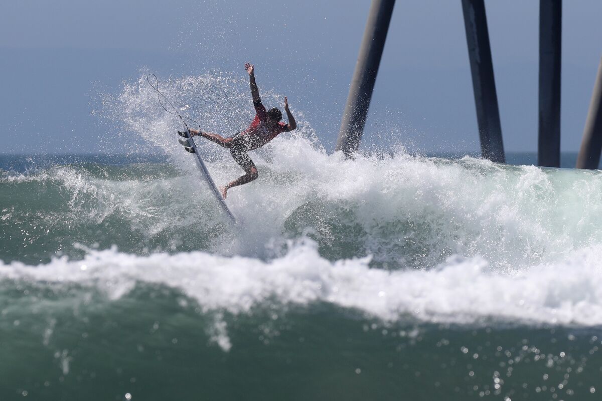 Brazilian surfer Joao Chianca catches big air during the U.S. Open of Surfing on Saturday.