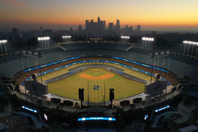 Los Angeles, California-Jan. 8, 2021-Dodger Stadium is lite up tonight in honor of the passing of Hall of Fame Los Angeles Dodger manager Tommy Lasorda, who passed away at the age of 93. (Carolyn Cole / Los Angeles Times)