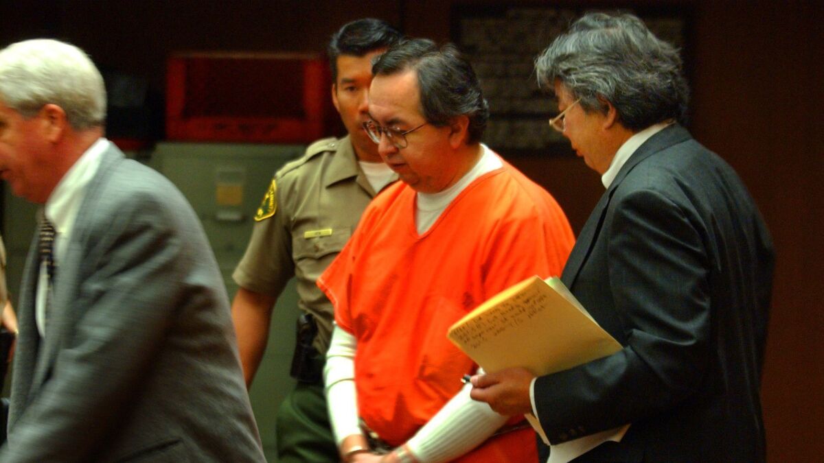 Carlos Rene Rodriguez appears in a Los Angeles courtroom in 2003 after he was accused of molesting an altar boy in the 1980s. The charges were dropped, but two more men have accused the priest of sex abuse in a new lawsuit.