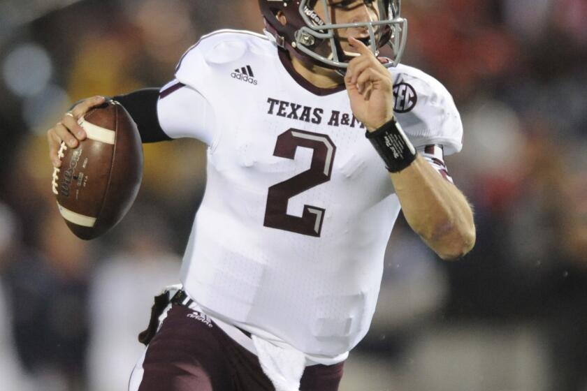 An autograph broker told ESPN that Texas A&M; quarterback Johnny Manziel was paid for signing football helmets.