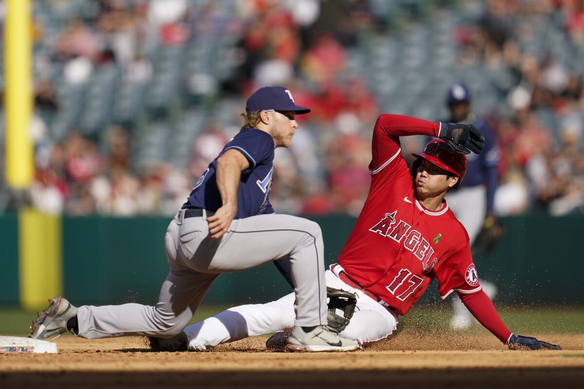 Angels' Shohei Ohtani steals second base ahead of a throw to Tampa Bay Rays shortstop Taylor Walls.