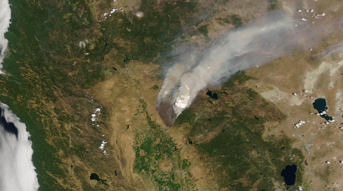 A satellite image shows smoke from the Park fire.