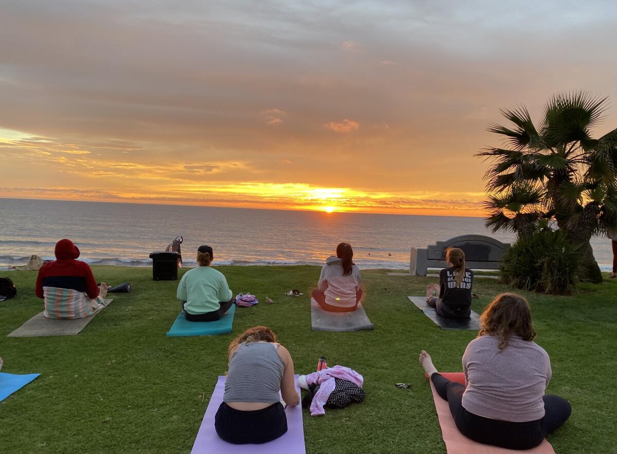 Participants in a PB Sunset Yoga class.