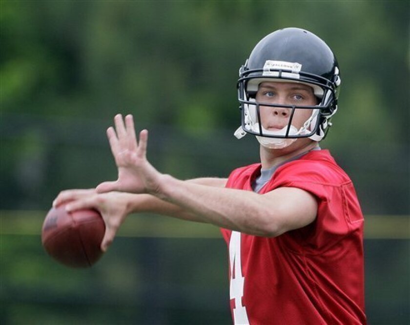 In this Friday, May 8, 2009, photo, Atlanta Falcons rookie quarterback John Parker Wilson drops back to throw during an NFL football minicamp in Flowery Branch, Ga. Because Wilson is listed fourth on the depth chart behind Matt Ryan, Chris Redman and D.J. Shockley, Wilson wasn't afforded a chance to work with an Atlanta receiving corps led by Tony Gonzalez, Pro Bowl wideout Roddy White, Michael Jenkins, Harry Douglas and Brian Finneran. (AP Photo/John Bazemore)